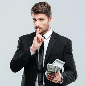 Man holding finger to his mouth hiding money