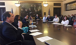 members sitting around a table